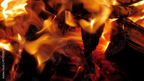Burning wood in the fire, a fire at night in the camp.flames close up, hot coals of burned wood. 