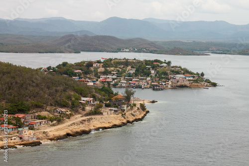 Cayo Granma Island with a fishing community in Santiago de Cuba bay photo