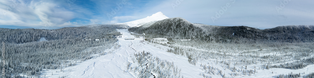 A blanket of fresh snow covers the wild, forested landscape surrounding Mt. Hood, Oregon. This scenic Pacific Northwest area is only an hour's drive from the bustling city of Portland. A blanket of fresh snow covers the wild, forested landscape surrounding Mt. Hood, Oregon. This scenic Pacific Northwest area is only an hour's drive from the bustling city of Portland.