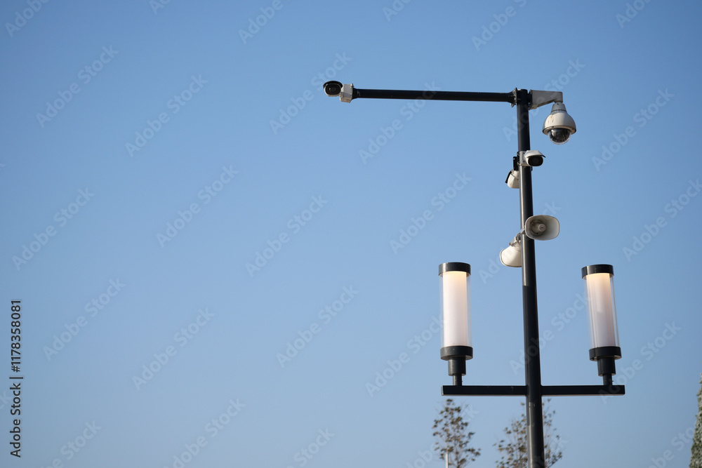 Modern Street Lighting with Surveillance Cameras in Clear Sky Modern Street Lighting with Surveillance Cameras in Clear Sky