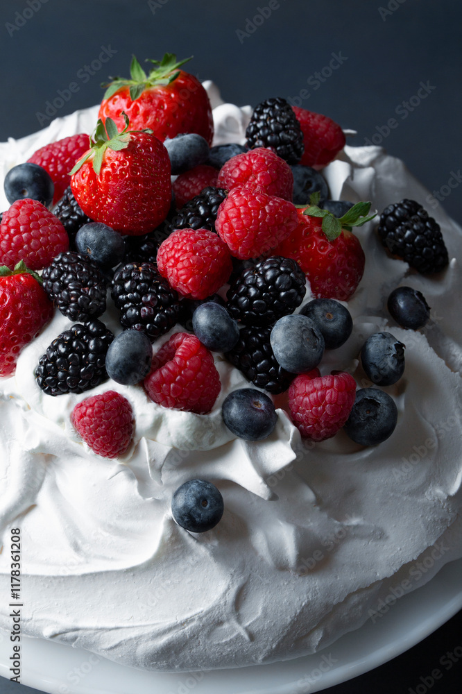 Mixed Berry Pavlova, tall marshmellow meringue topped with straberries, blueberries, blackberries and raspberries Mixed Berry Pavlova, tall marshmellow meringue topped with straberries, blueberries, blackberries and raspberries