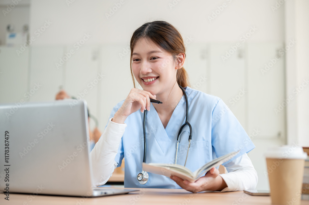 A smart Asian female medical student is focused on reading medical cases on her laptop. A smart Asian female medical student is focused on reading medical cases on her laptop.