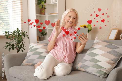 Mature woman with tablet co...