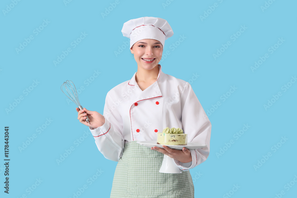 Female confectioner with whisk and cake on blue background Female confectioner with whisk and cake on blue background
