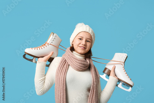 Cute girl with ice skates o...