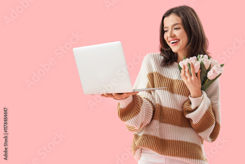 Young woman with laptop and...
