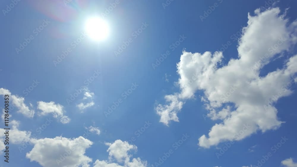 A vibrant blue sky illuminated beautifully by the warm sun, showcasing soft clouds for uplifting and joyful visuals A vibrant blue sky illuminated beautifully by the warm sun, showcasing soft clouds for uplifting and joyful visuals
