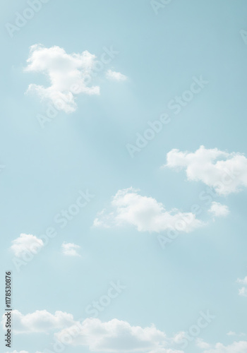 Serene Light Blue Sky with Fluffy White Clouds Peaceful Nature Background Image