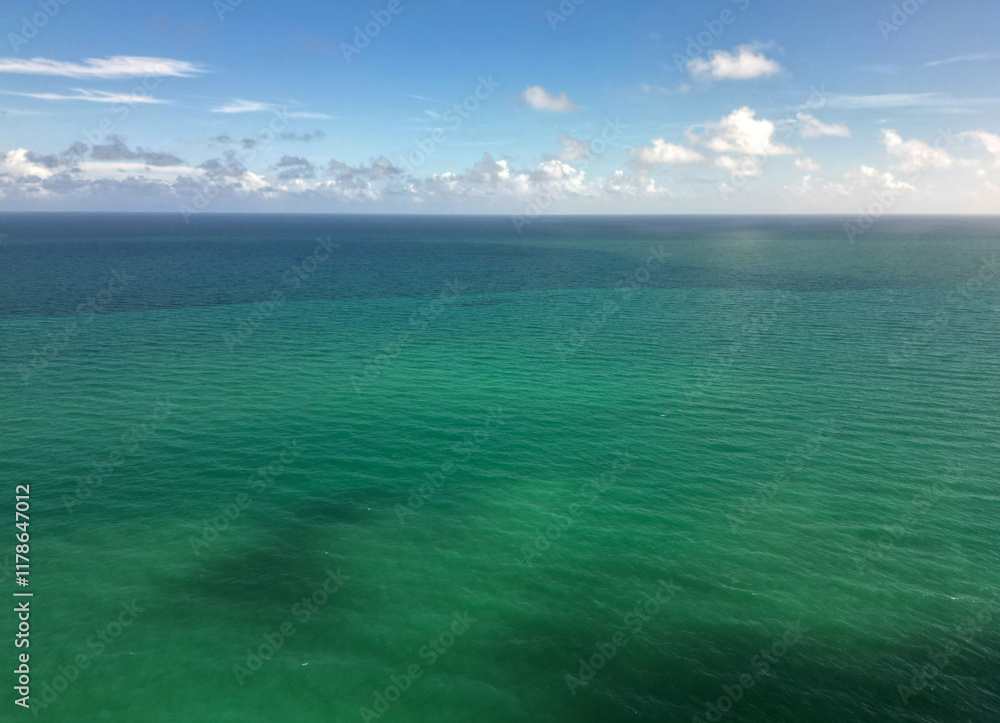 Obraz premium Skyscape with sea horizon. Calm horizon view at sea nature. Romantic summer vacation view on seascape. Sea horizon view. Cloudy sky and seascape at summer vacation