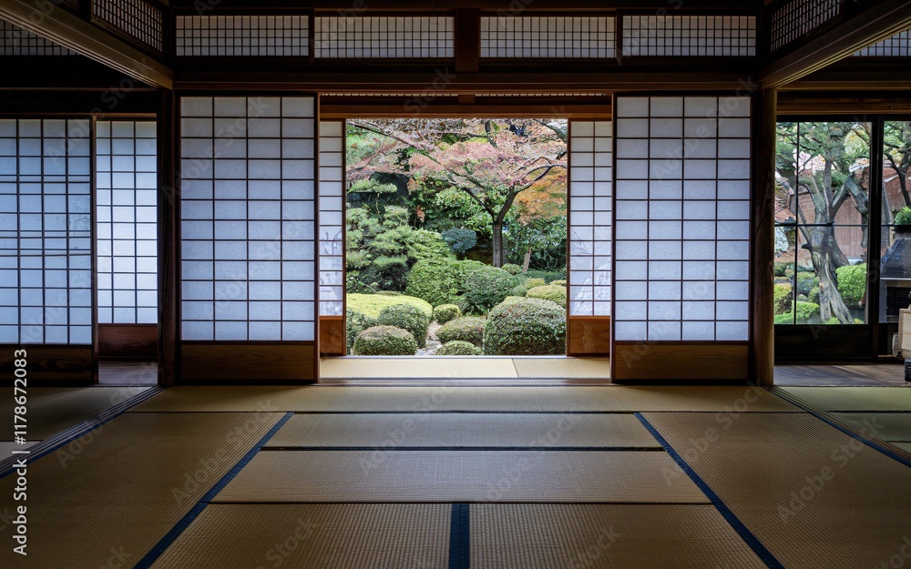 Obraz premium Traditional Japanese Tea House Tranquil Japanese room with shoji screens opening to serene garden.