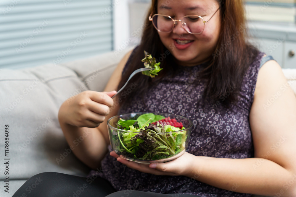 Asian Overweight woman dieting Weight loss eating fresh fresh homemade salad healthy eating concept Obese Woman with weight diet lifestyle. Asian Overweight woman dieting Weight loss eating fresh fresh homemade salad healthy eating concept Obese Woman with weight diet lifestyle.