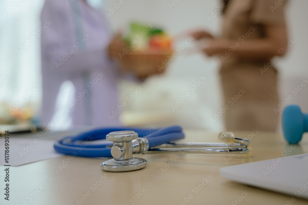Female doctor or nutritionist sitting at table with fresh fruits and vegetables to promote healthy eating and living, nutrition and weight control. Female doctor or nutritionist sitting at table with fresh fruits and vegetables to promote healthy eating and living, nutrition and weight control.