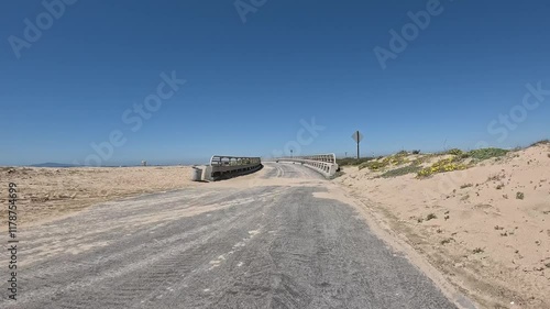 Huntington Beach California bike trail and riding over a small bridge. photo