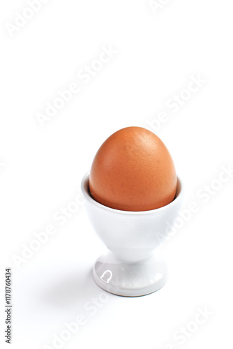 Whole boiled egg in egg cup