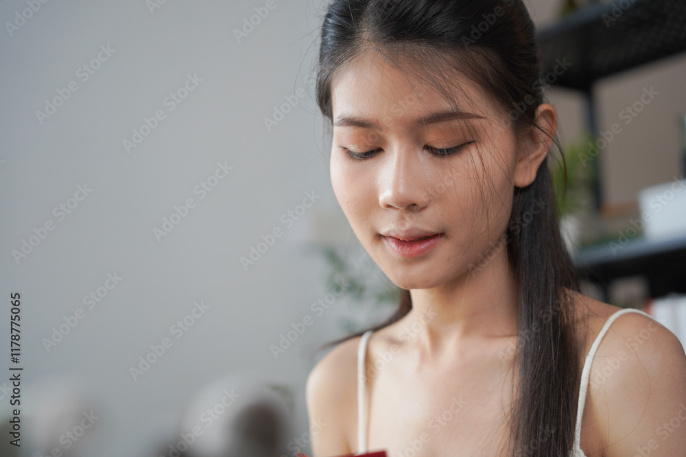 Asian woman influencer beauty blogger live streaming reviews her cosmetics on online platform. Asian woman influencer beauty blogger live streaming reviews her cosmetics on online platform.