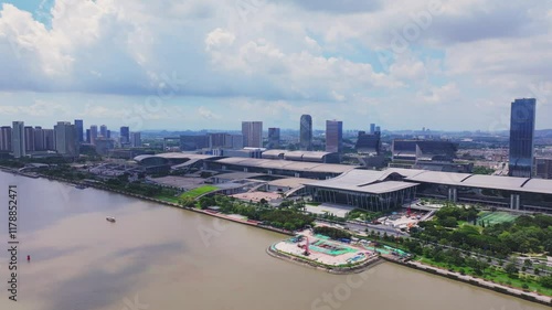 Explore Guangzhou Pazhou Convention and Exhibition Center through stunning aerial shots showcasing cityscape and riverside views photo