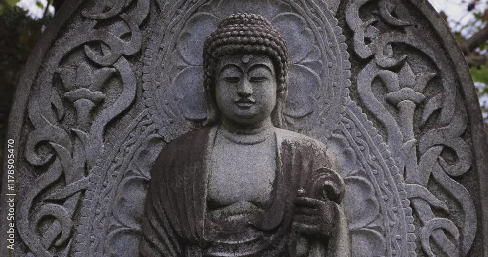 A religious stone statue of Akshobhya at Japanese buddhism temple A religious stone statue of Akshobhya at Japanese buddhism temple