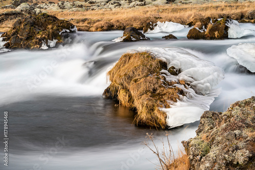 Panoramic view of flowing rushing water on the river in Kirkjubæjarklaustur or Kirkjubaejarklaustur, Iceland photo