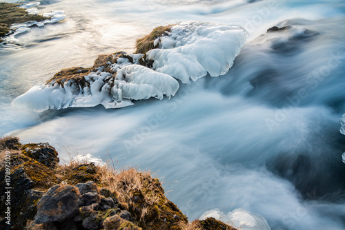 Panoramic view of flowing rushing water on the river in Kirkjubæjarklaustur or Kirkjubaejarklaustur, Iceland photo