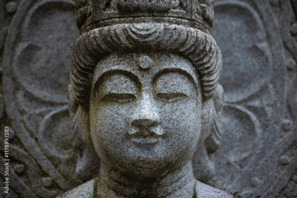 A religious stone statue of Maitreya at Japanese buddhism temple A religious stone statue of Maitreya at Japanese buddhism temple