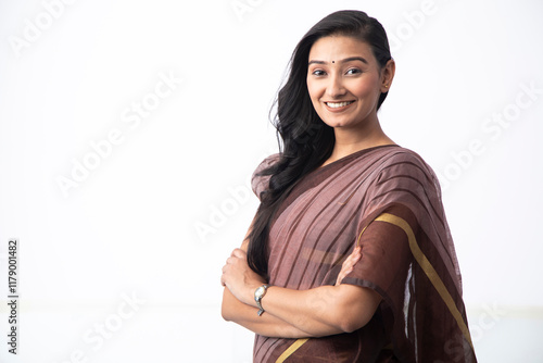 Happy Indian Housewife In Saree Looking At Camera