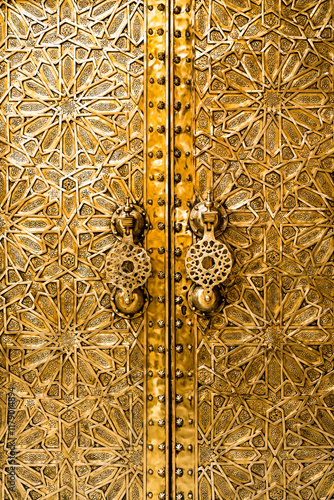Close up detail of ornate golden door in Fez, Morocco
