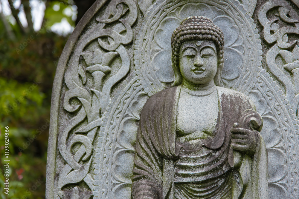 A religious stone statue of Akshobhya at Japanese buddhism temple A religious stone statue of Akshobhya at Japanese buddhism temple