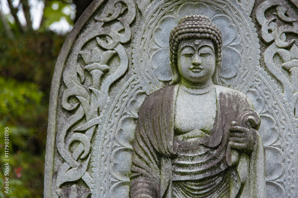 A religious stone statue of Akshobhya at Japanese buddhism temple A religious stone statue of Akshobhya at Japanese buddhism temple