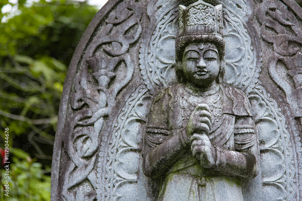 A religious stone statue of Dainichi Nyorai at Japanese buddhism temple A religious stone statue of Dainichi Nyorai at Japanese buddhism temple