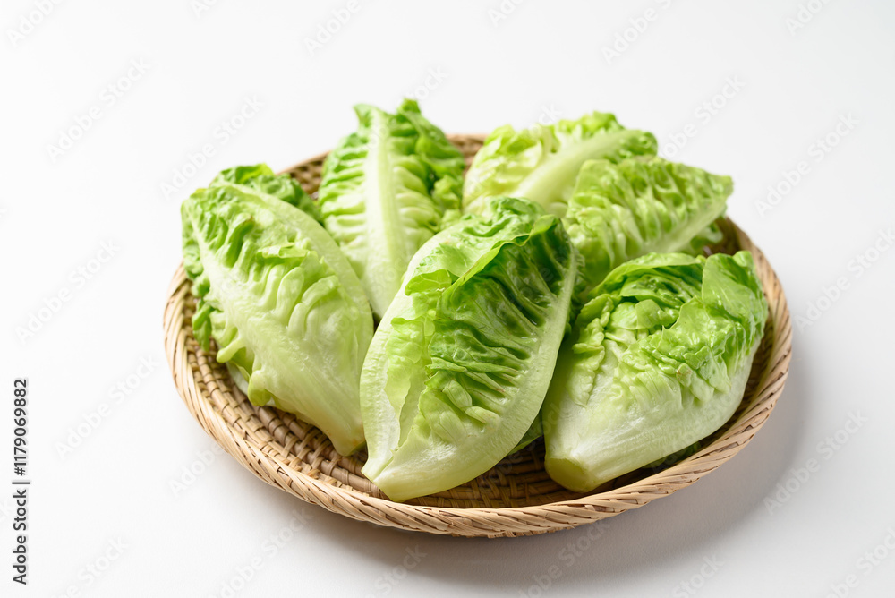 Baby cos lettuce romaine in basket on white background, Fresh vegetable Baby cos lettuce romaine in basket on white background, Fresh vegetable