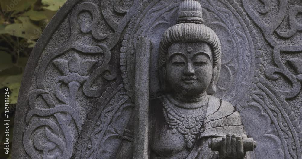 A religious stone statue of Manjusri at Japanese buddhism temple A religious stone statue of Manjusri at Japanese buddhism temple