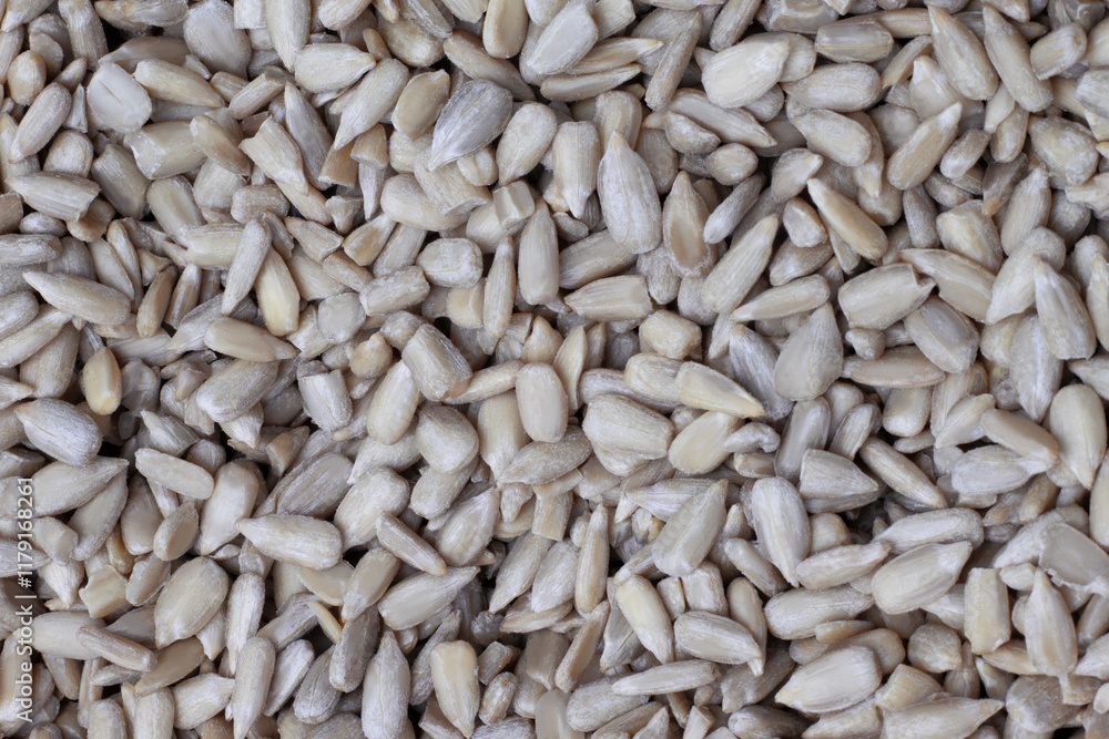Background of hulled sunflower seeds in close-up Background of hulled sunflower seeds in close-up