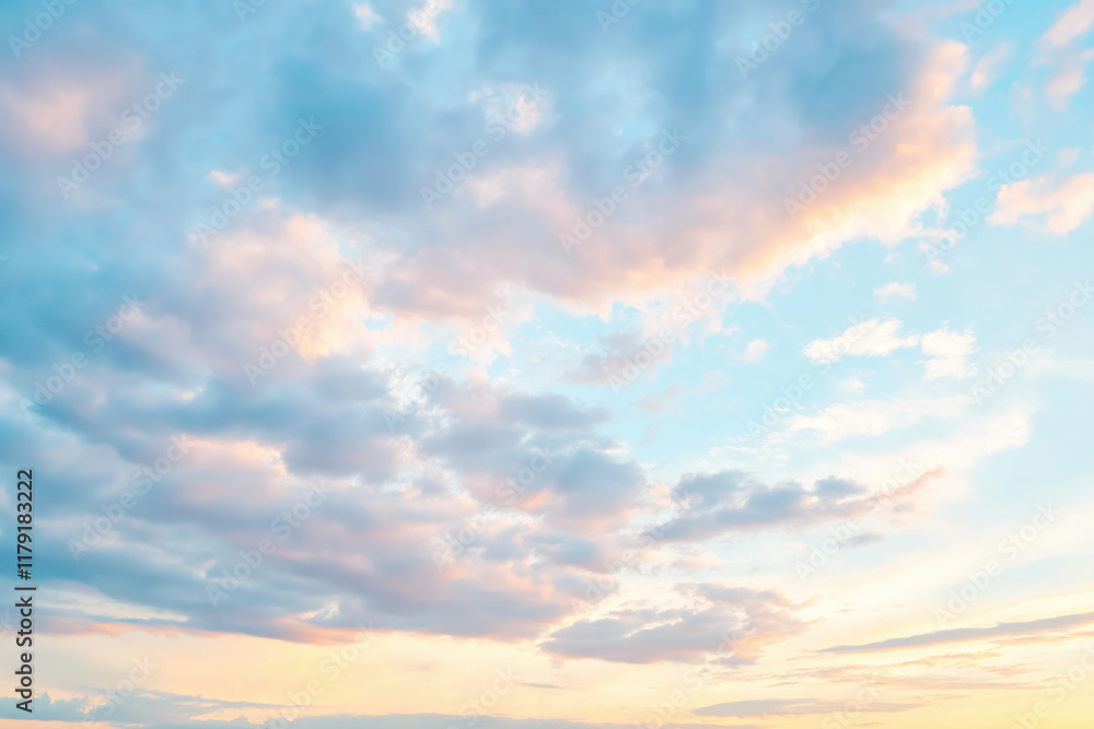 Fototapeta premium Serene sunrise sky with pastel clouds and soft light