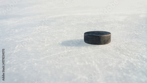 Canvas Print hockey puck and ice on the scratches surface abstract background ice arena