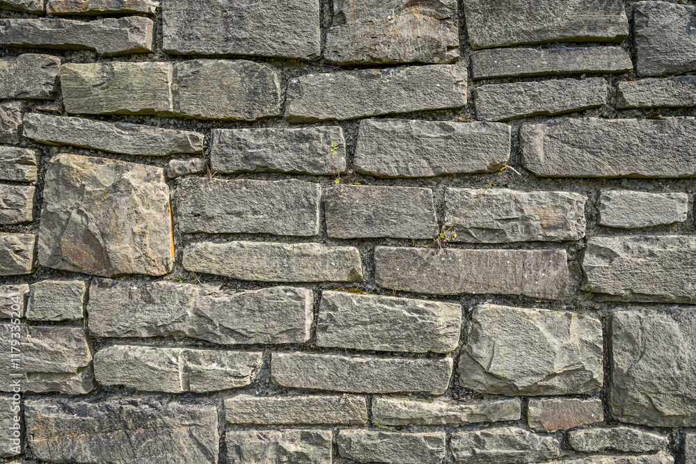 Old rustic wall made of gray blocks. Natural background.
