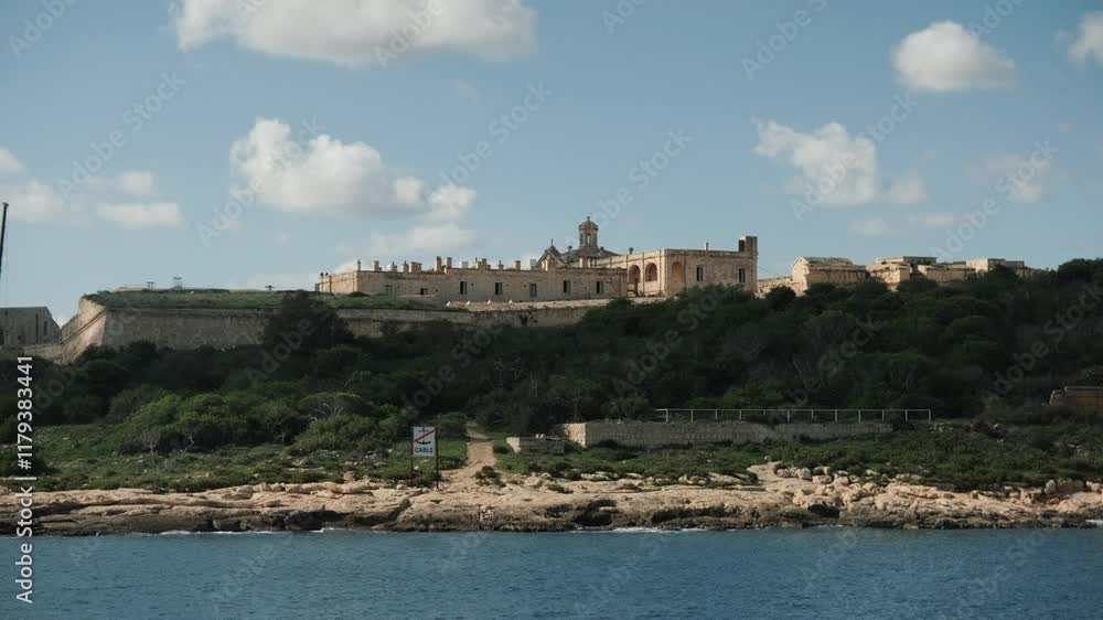 A Historical Fortification by the Water Located in Malta, Showcasing Its Rich Heritage A Historical Fortification by the Water Located in Malta, Showcasing Its Rich Heritage