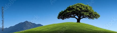Serene Landscape: A lone tree stands tall on a verdant hill against a clear blue sky, mountains in the distance.  A picturesque scene of tranquility and natural beauty. 