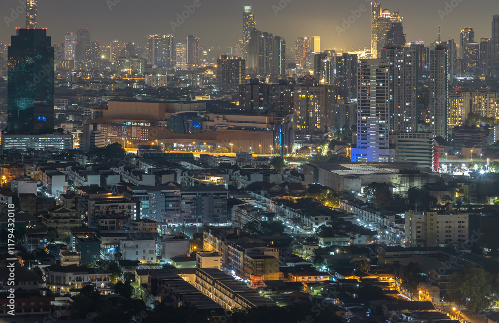 Nightscape view after sunset of Skyscrapers in the business district of downtown in the Bangkok city. City night view of Modern buildings after sunset with bright glowing lights, use as your Wallpaper