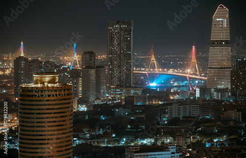 Obraz na płótnie Night view after sunset of Skyscrapers in the business district and Bhumibol Bridge. Beautiful city of Bangkok with bright glowing lights in the sundown, use it as your Wallpaper,Poster and Copy space w salonie