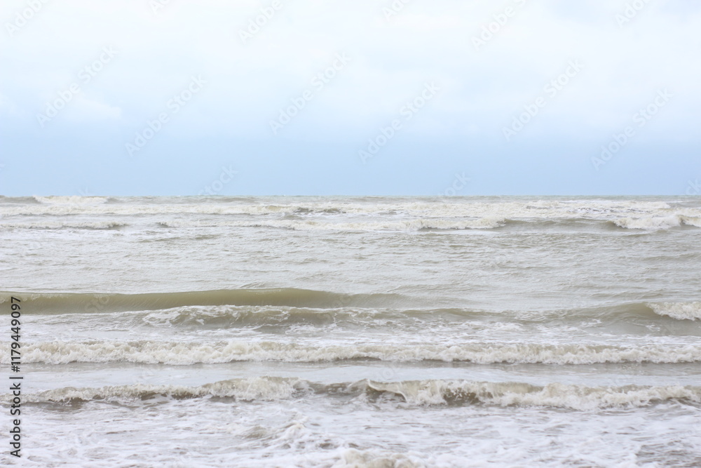 Obraz premium Baltic sea under the dark dramatic clouds after thunderstorm. Epic seascape. Cyclone, gale, storm, rough weather, meteorology, ecology, climate change, natural phenomenon. Grand Cayman island summer.