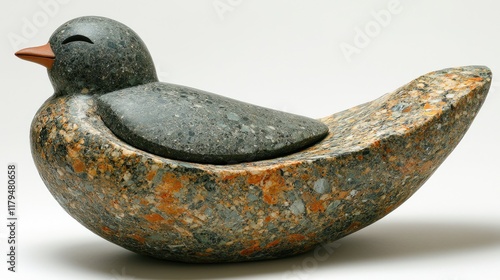 Stone bird sculpture, resting pose, studio setting, abstract art piece. photo