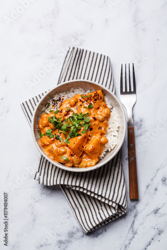 Vegan curry chickpea stew with vegetables in white bowl.