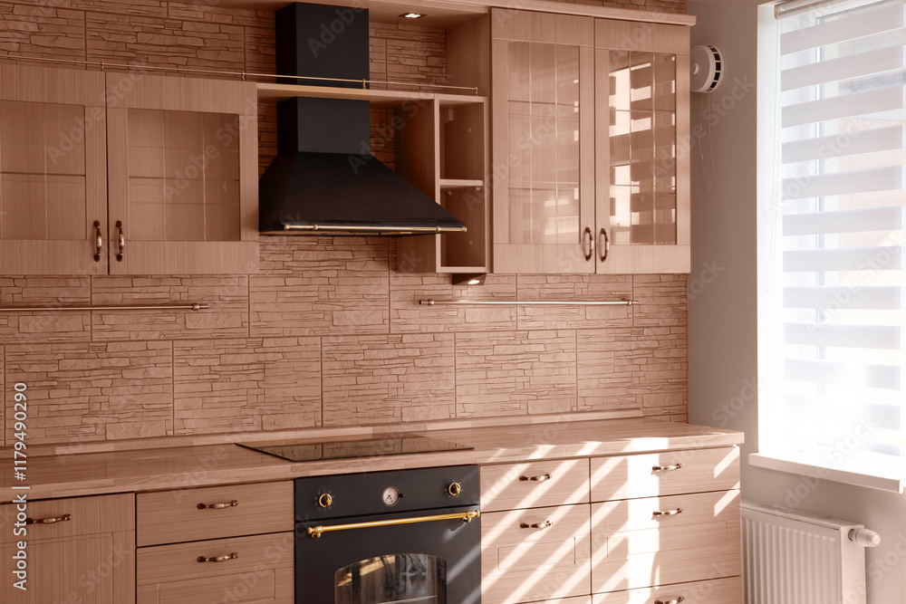 Fototapeta premium Modern interior of a combined kitchen and living room with colors of the year 2025 Mocha Mousse in classic style