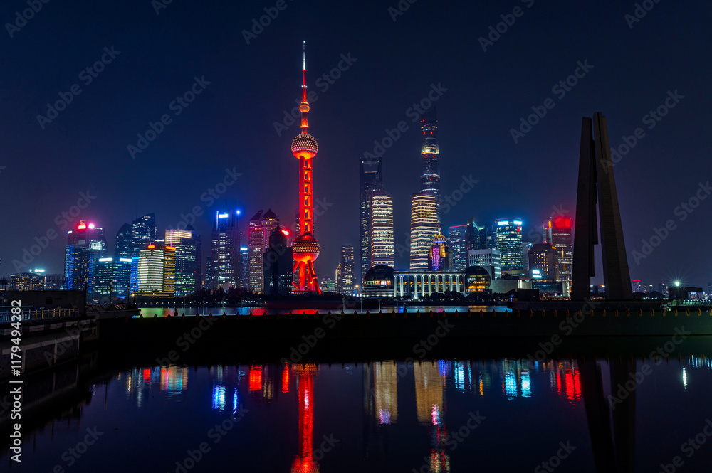 Sunset of Shanghai city modern skyscraper night light cityscape in twilight blue sky in autumn season behind pollution haze, view from the bund in Shanghai, China.