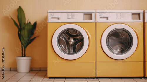 Wallpaper Mural Laundry shop concept. Bright yellow washing machines in cozy laundromat with plant Torontodigital.ca