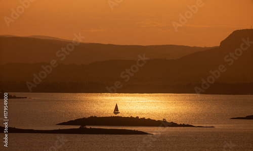 Sailboat in the golden evening sun. Oslofjord