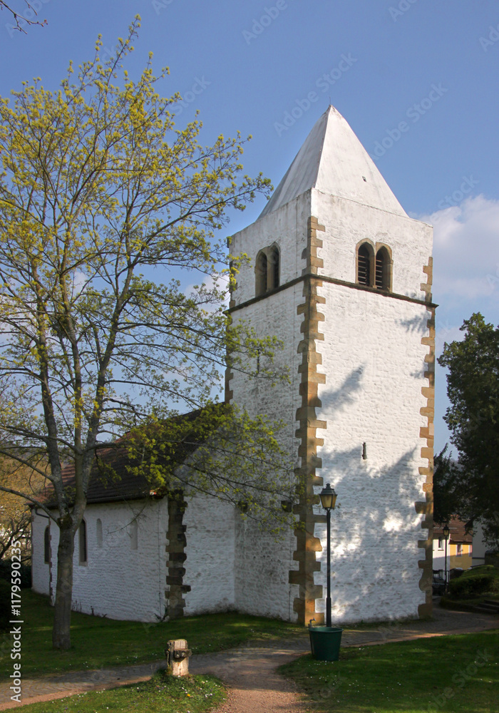 Fototapeta premium Old romanesque church of St Johannes with medieval bell tower in Bad Münster am Stein-Ebernburg in Germany