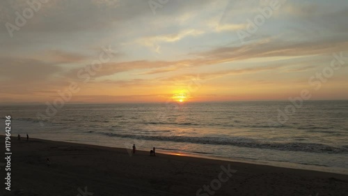 Atardecer y poca gente en la playa photo