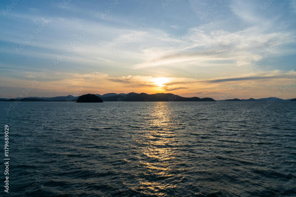Sunset off the coast of Phuket near Ao Phang Nga National Park Sunset off the coast of Phuket near Ao Phang Nga National Park