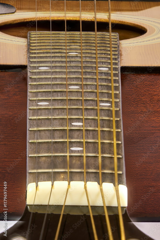 Obraz premium Modern style wooden acoustic guitar isolated, showing some specific parts, with metal strings, ideal for Rock music